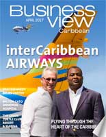 April, 2017 Issue cover for Business View Caribbeam. Two men are standing in front of the tail of an airplane.