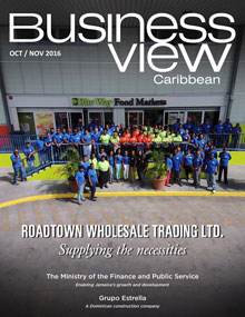 Business View Caribbean October 2016 cover featuring Roadtown Wholesale Trading Ltd. with a photo of employees standing at the front of a building.