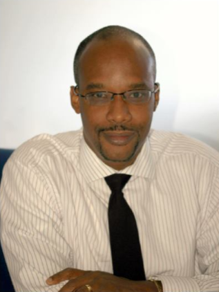 A portrait photo of Marlon Yarde, General Manager of the Barbados Stock Exchange