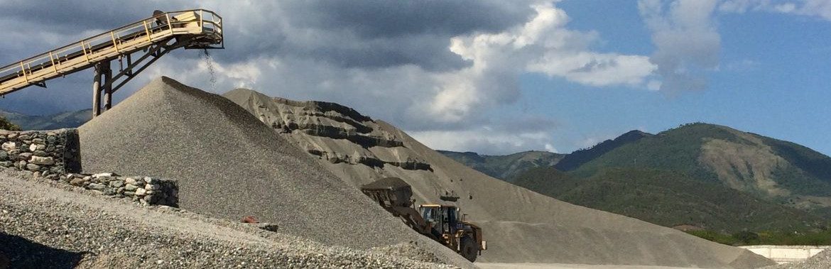 Jamaica Premix. Piles of earth and conveyor equipment.