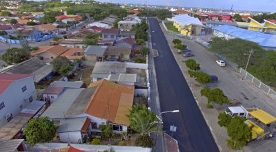 CWM Infrastructure, aerial view of a newly paved street next to houses.