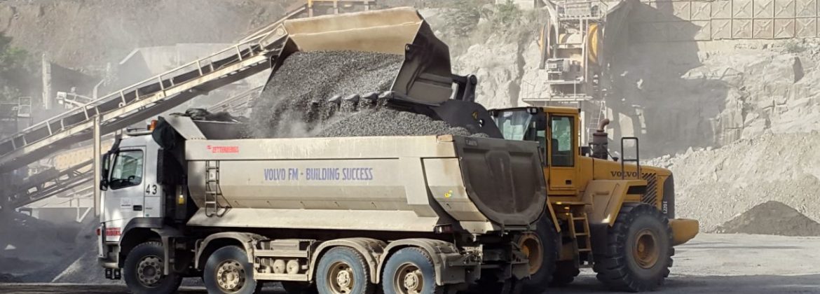 Wilrock Limited loader filling up a dump truck.