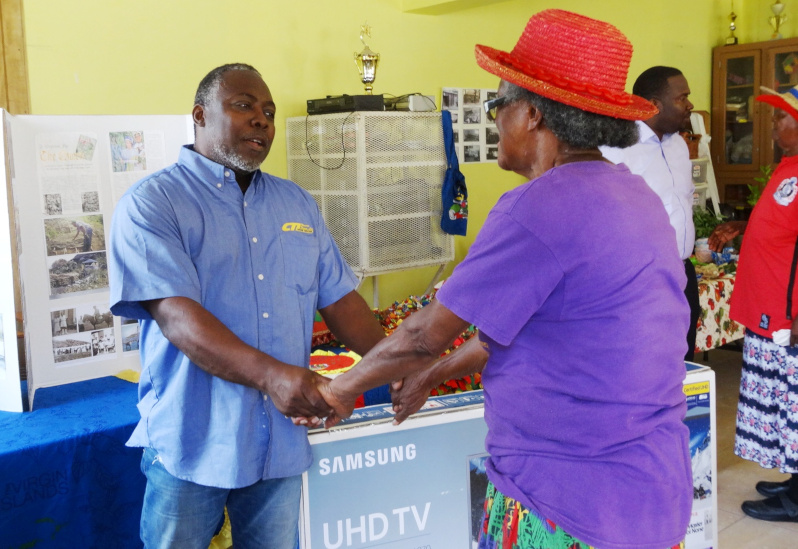 Michael Thomas Donating TV to Elders. Clarence Thomas Limited Home Center / CTL Home Center.