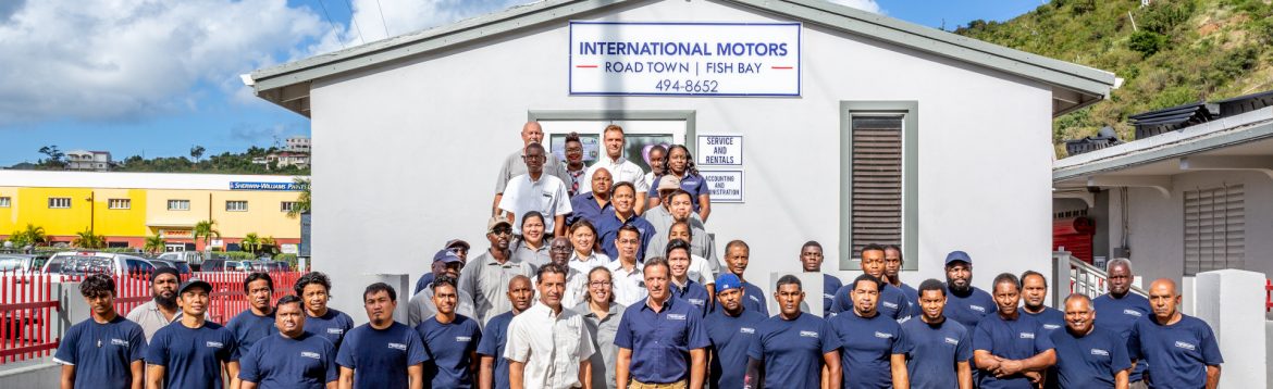 International Motors BVI / British Virgin Islands group photos of staff in front of their building.