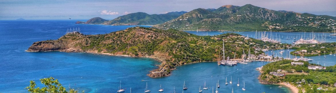 Antigua island photo from high up looking down onto sailboats and the town.