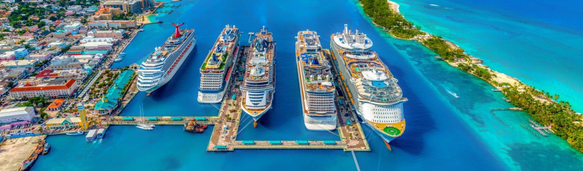 A row of cruise ships at a port in Nassau Bahamas.