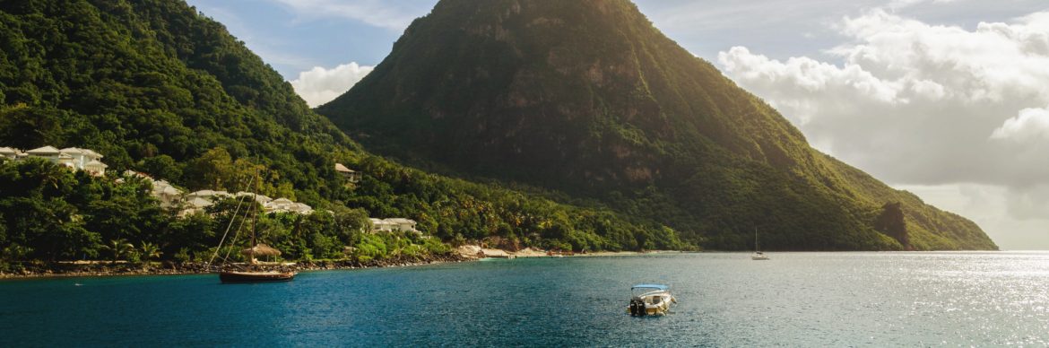 Montserrat Port Authority. View of the island from the water with two boats in view.