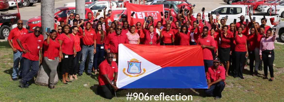 TelEm Group Sint Maarten group photo with #906 reflection printed on it.