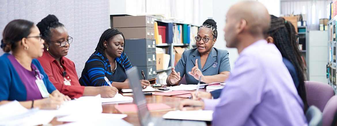 Bureau of Standards Jamaica BSJ Day meeting of people at a table.