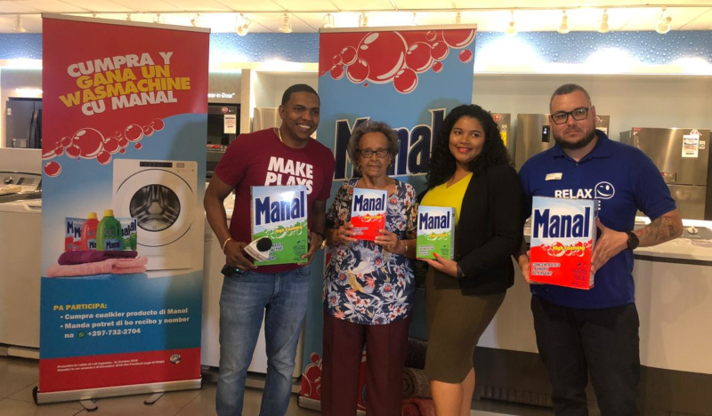 Frasa International Trading N.V. four people holding up Manal products.